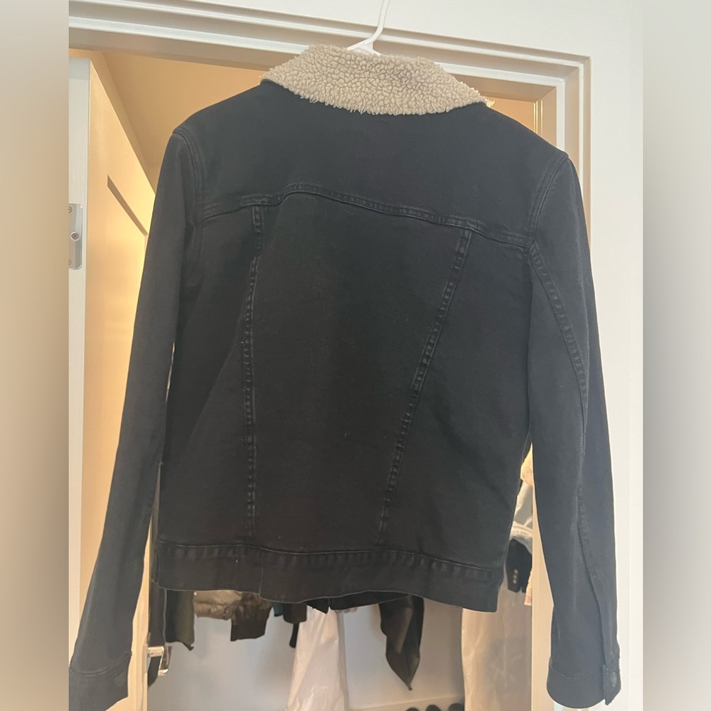 Black denim and shearling jacket